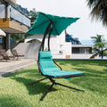 Outdoor hammock-style lounge chair with parasol, curved steel frame, and soft cushions, perfect for patios, gardens, and poolside areas.
